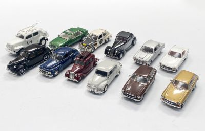 a lot of toy cars that are lined up together