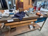 a workbench with a lot of tools on top of it