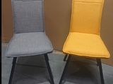 two chairs that are next to each other on the floor
