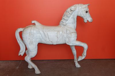 a white statue of a horse that is standing on its hind legs