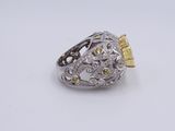 a yellow sapphire and diamond ring on a white background