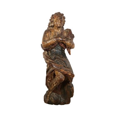 wooden statue of a man holding a bird on a white background