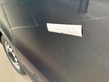 a sticker on the hood of a black car