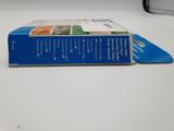 a blue box on a white table with a computer in the background