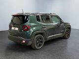 the back of a green jeep renegade parked in a room