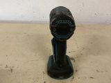 a black and blue fire hydrant sitting on a table
