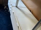 a picture of a room with a blue carpet and a white dresser