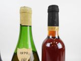 three bottles of wine sitting next to each other on a table