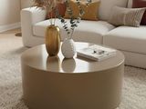 a coffee table with a vase on top of it in a living room
