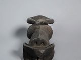 statue of a cow head on a white surface