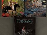 three books on a black surface with a person riding a horse and a man riding a horse