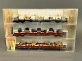 a display case with a bunch of toy trains on it