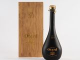 a bottle of wine sitting next to a wooden box
