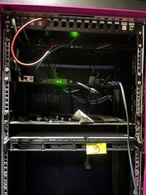 an image of a pink computer case with a green light in it