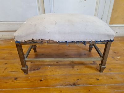 an old bench that has been painted white and has been cleaned