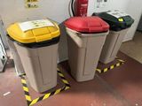 three trash cans sitting next to each other on the floor