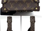 a picture of a brown louis vuitton bag with gold hardware