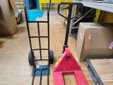 a hand truck that is sitting on the floor