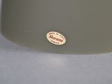 a close up of a white bowl with a sticker on it