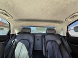 two seats in the back of a car that is empty