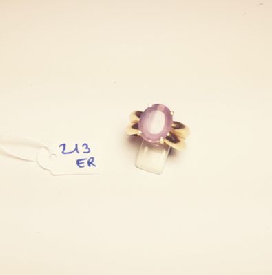 a ring with a purple stone on it and a price tag