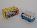 a small toy van that is next to a box