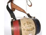 an old fashioned fire extinguisor with a leather strap