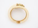 a close up of a ring with a leopard on it