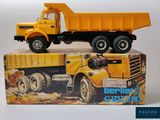 a toy truck that is sitting on top of a box
