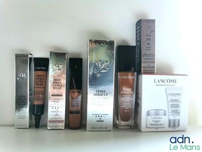 many different types of makeup products on a shelf