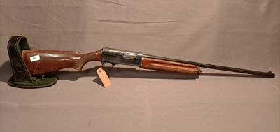 an old gun with a wooden handle and a wooden handle