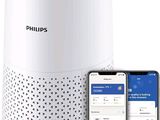 Le purificateur d'air Philips se trouve à côté d'un iPhone et d'un smartphone
