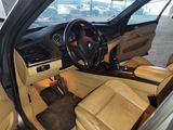 a view of the inside of a car from the driver ' s seat