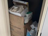 a cardboard box in the corner of a small room