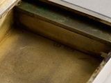 a metal box that has a metal lid on it