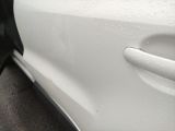 a close up of a white car with a black door handle