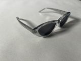 sunglasses on a table with a white table cloth and a white table cloth
