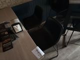 two chairs and a table in a small room