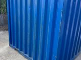 a blue container sitting in the middle of a driveway