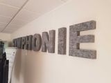 a sign that says one on one hanging on the wall