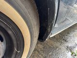 a close up of a tire on the side of a car