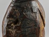 a close up of a wooden vase with a bird on it