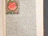 an open book with a picture of an apple on it