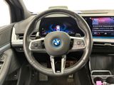 the interior of a car with a steering wheel and dashboard
