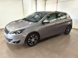 the silver car is parked in the garage of a building