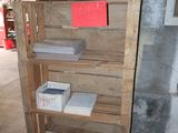 a wooden shelf with books on it in a room