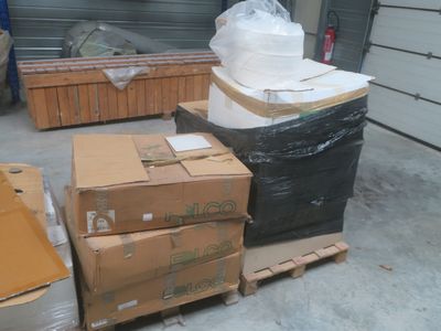 many boxes and boxes on a pallet in a warehouse