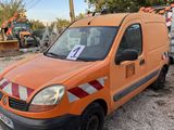an orange van is parked in a lot with other vehicles