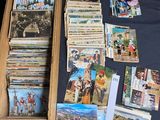 a wooden box filled with cards and pictures on a table