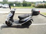 a scooter that is parked in a parking lot